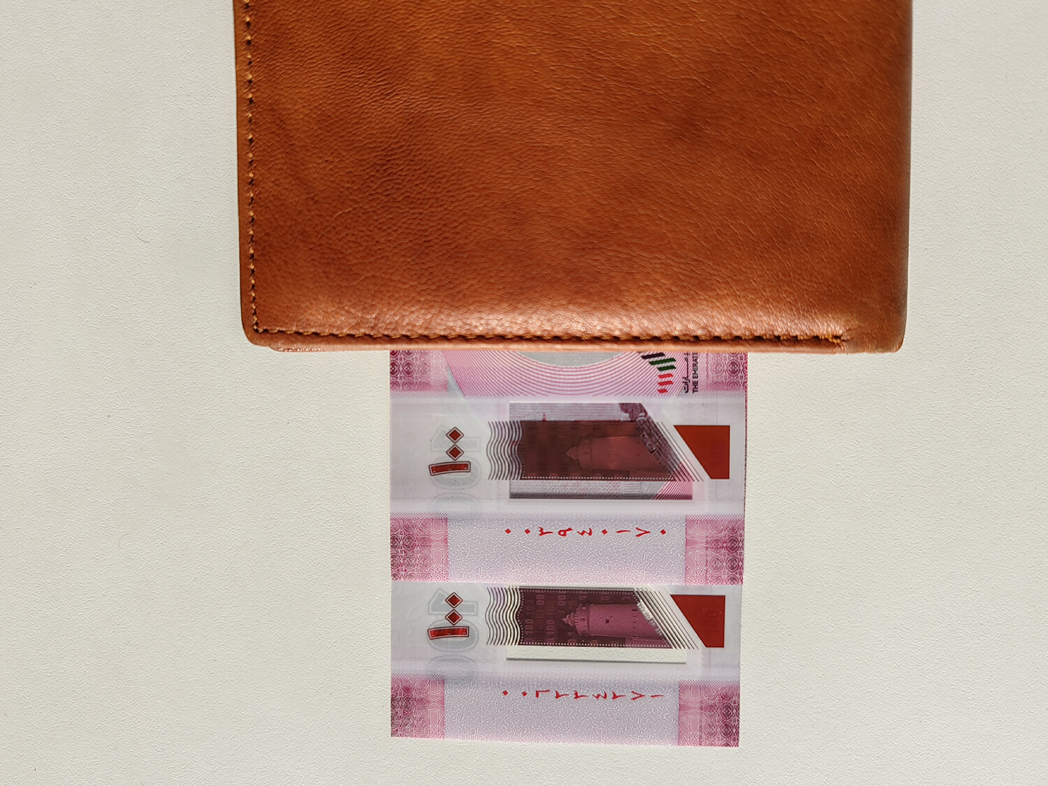 Hundred Dirhams Currency Notes in Wallet